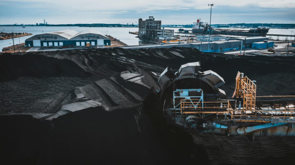 Aerial view of a coal industry yard with machinery in Baltimore harbor.