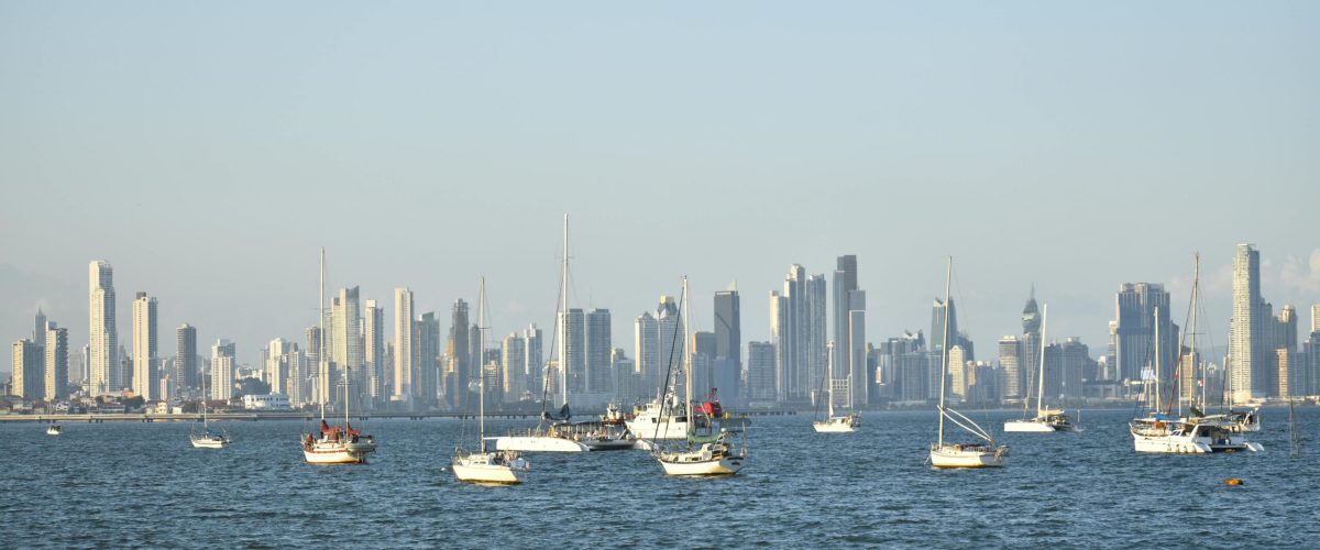 pexels-photo-5005136-5005136 Scenic view of Panama City skyline with sailboats on the calm sea at daytime.